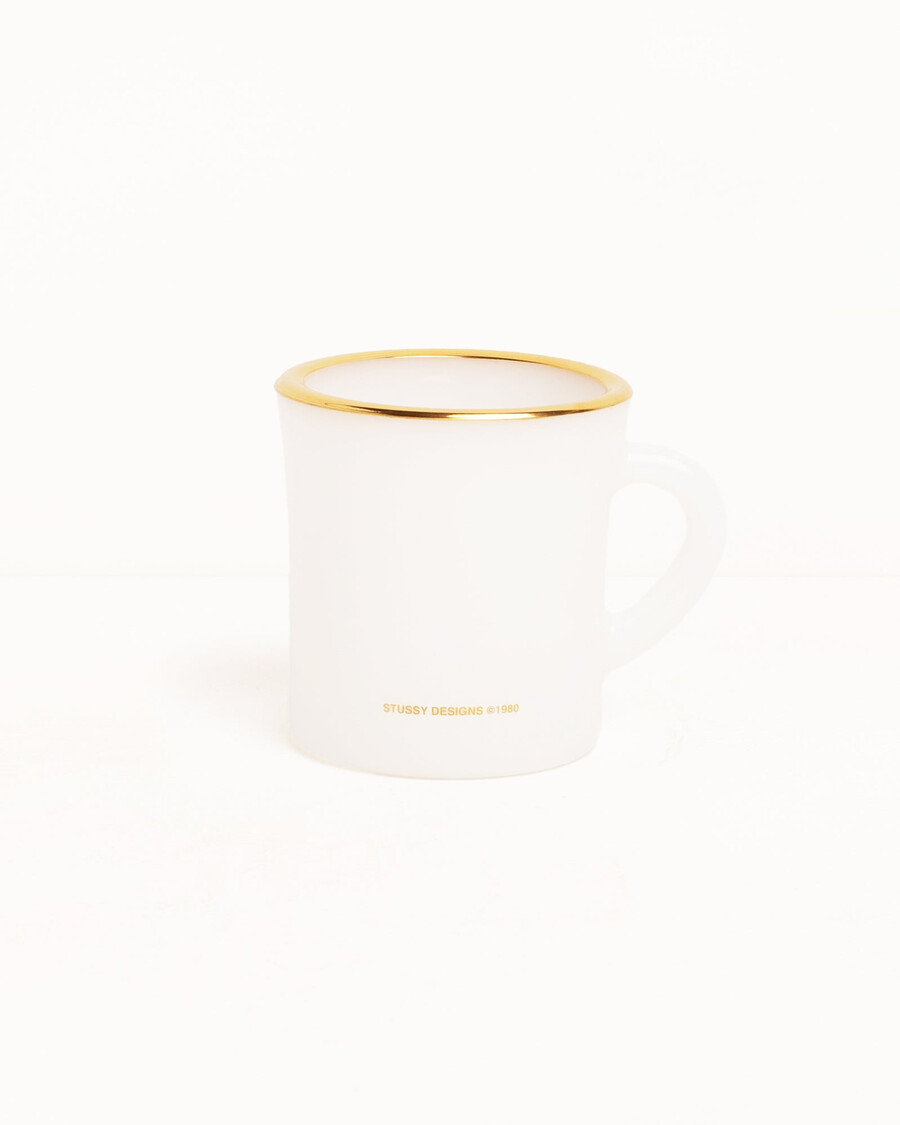 taza de cristal con leche laguna